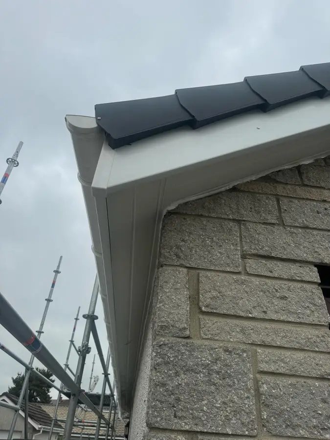 Fascia, soffit and gutter meeting at a corner of the roof