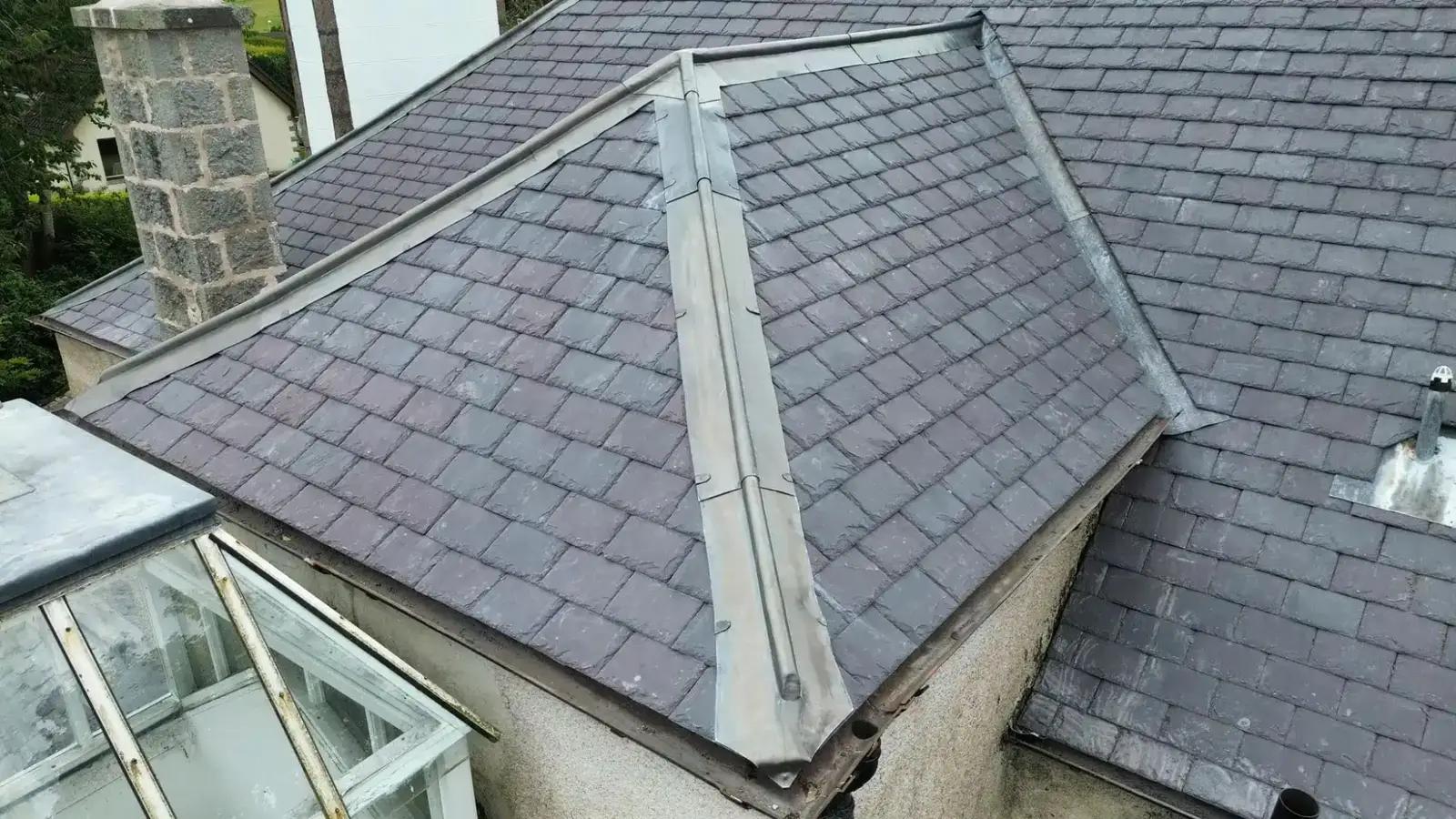 Close view of slate and lead hips around a roof lantern